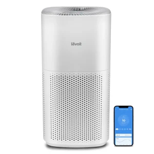 Levoit Smart Air Purifier Core 600S in white with smartphone app display, showcasing sleek design and perforated base.