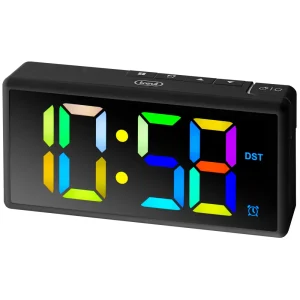 Trevi EC 886 black digital alarm clock shown at an angle, with a large multicolour LED display on a white background.