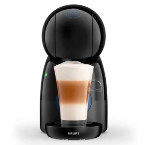 Krups Dolce Gusto Piccolo XS Coffee Machine in black, brewing a latte in a glass cup, with a white background.