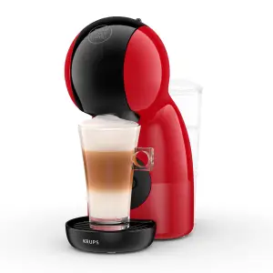Krups Dolce Gusto Piccolo XS Coffee Machine in red with a glass of latte on a black drip tray against a white background.