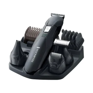 Remington Stainless Steel Hair and Beard Trimmer - PG6030 displayed on a black charging base with various attachments.