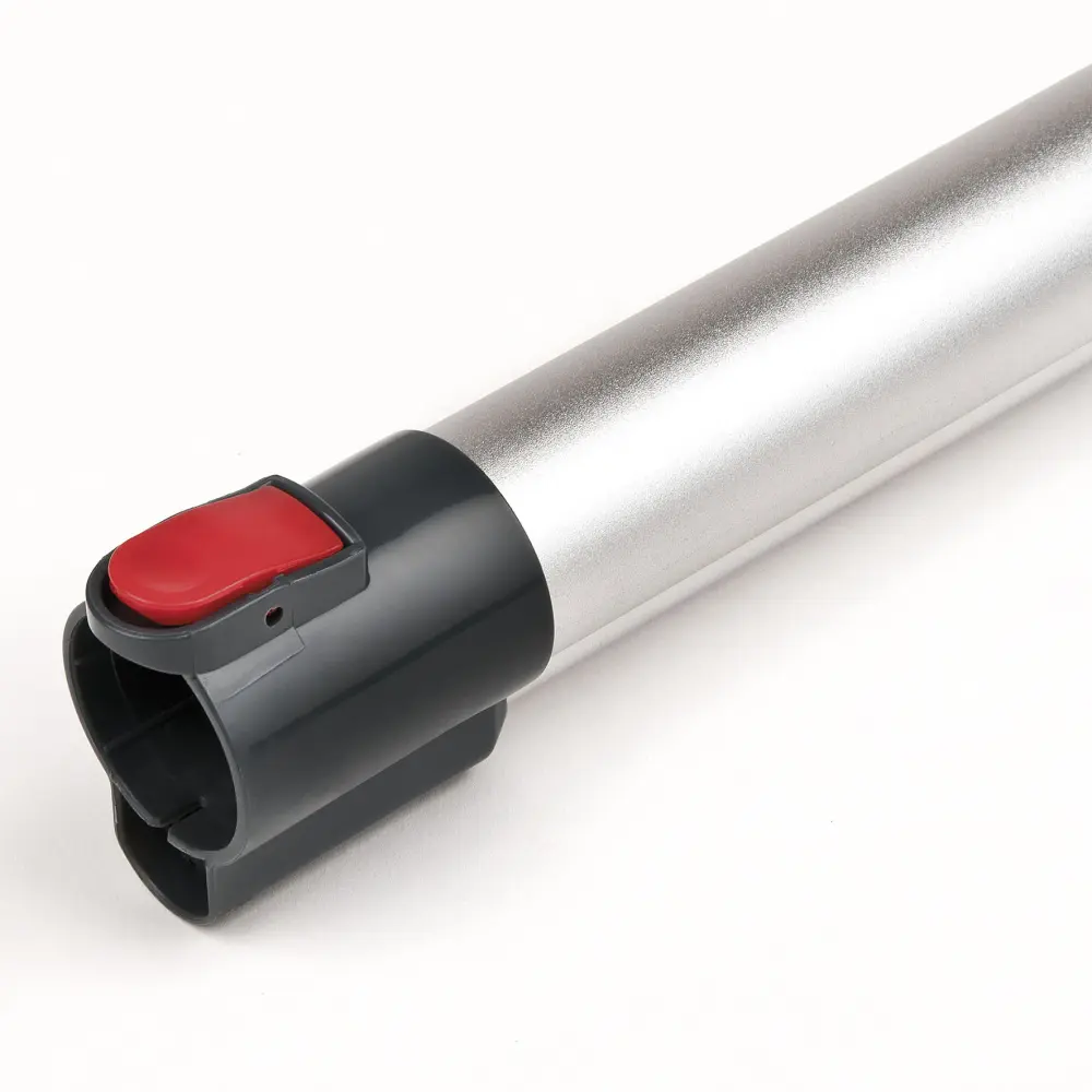 Close-up of the Girmi AP91 cordless vacuum cleaner’s silver tube and black connector with red release button on a white