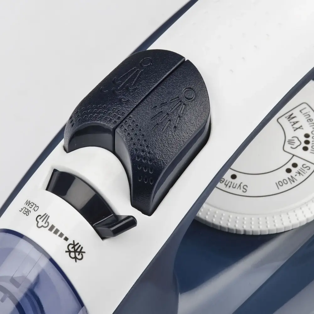 Close-up of the G3 Ferrari 2000W Steam Iron Opera G40014, showing black steam controls, white temperature dial and blue water