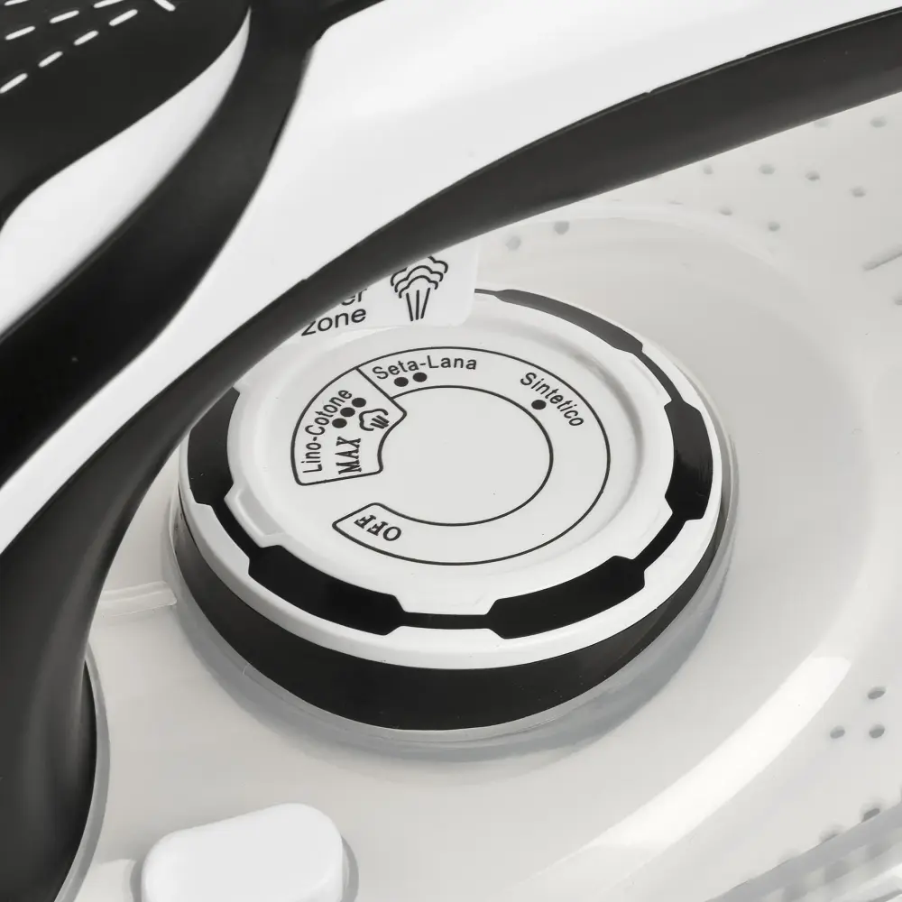 Close-up of the G3 Ferrari 3000W Steam Iron G40024 Eliseo 3000 temperature dial, with fabric settings on a white and black